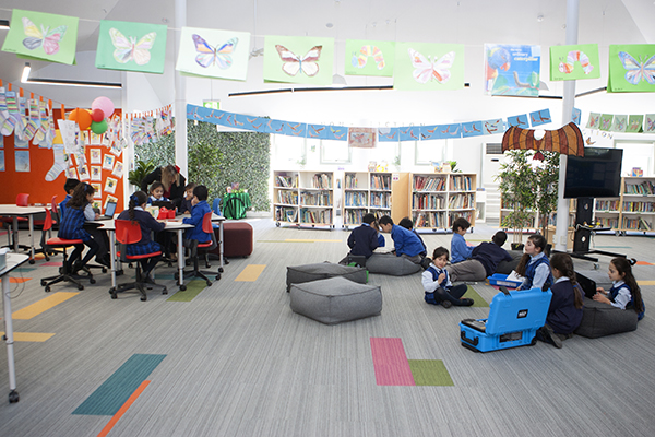 students reading and doing work in the flexible learning areas